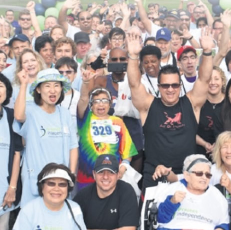 Walk participants celebrating at the Project Independence Walk For Independence