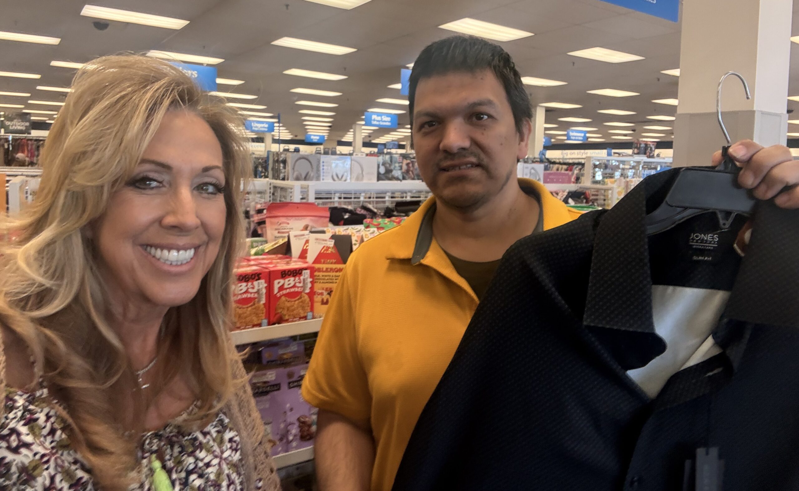 Angel shopping for work clothes with Project Independence job coach Carla Compton